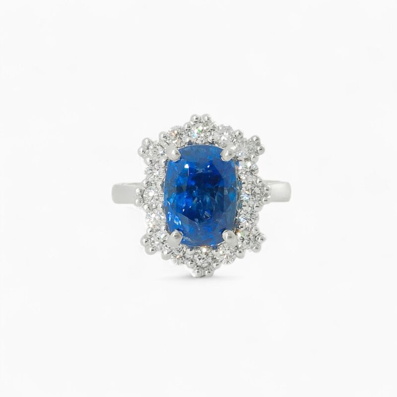 Saraya sapphire and diamond ring in platinum with cushion cut blue sapphire and diamond halo