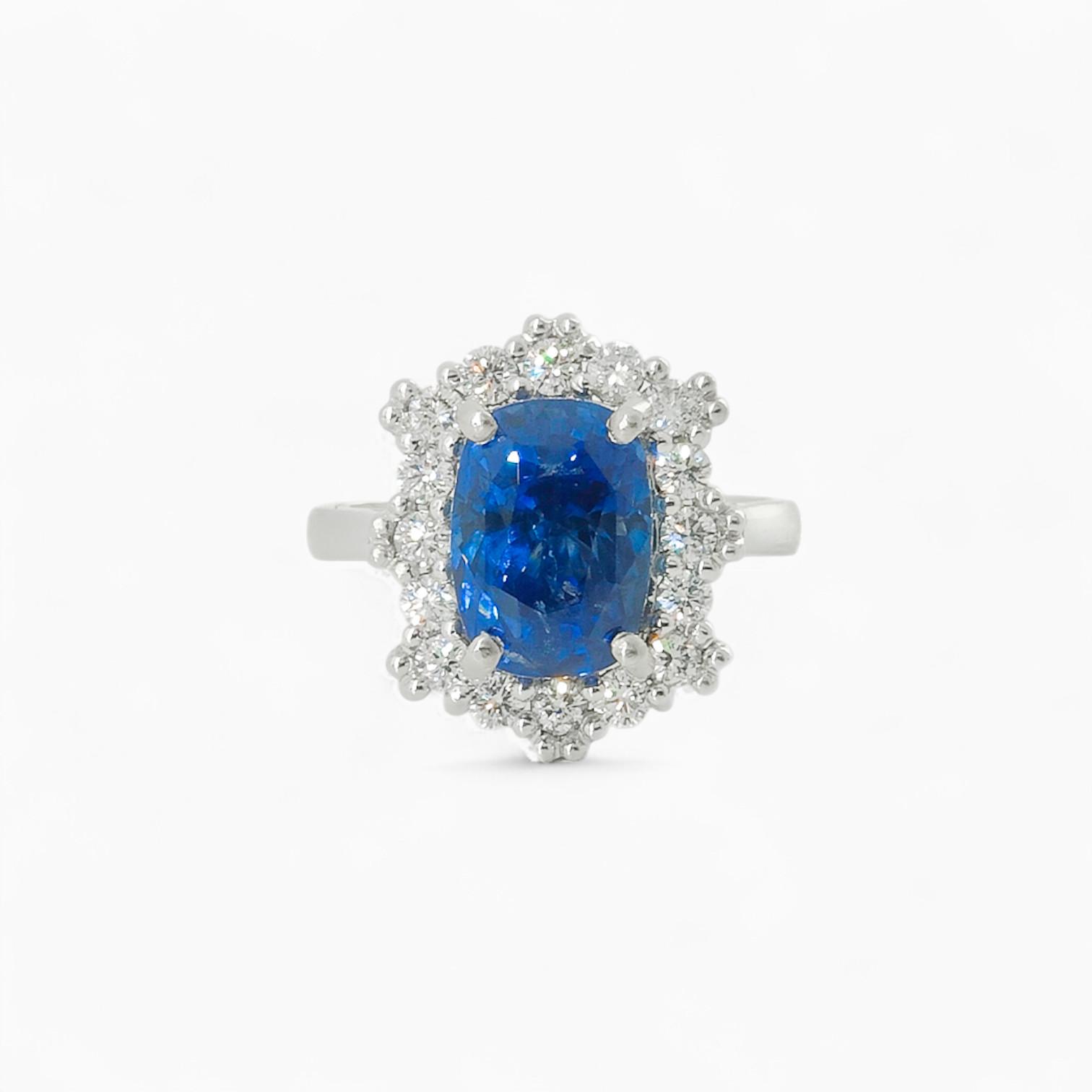 Saraya sapphire and diamond ring in platinum with cushion cut blue sapphire and diamond halo