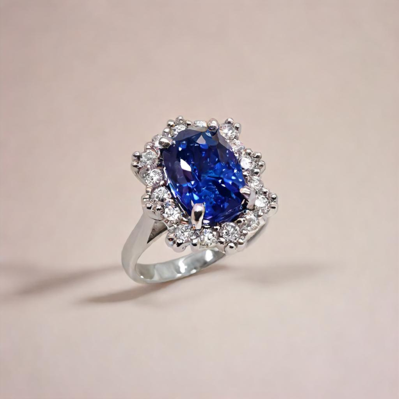 Saraya sapphire and diamond ring in platinum with cushion cut blue sapphire and diamond halo