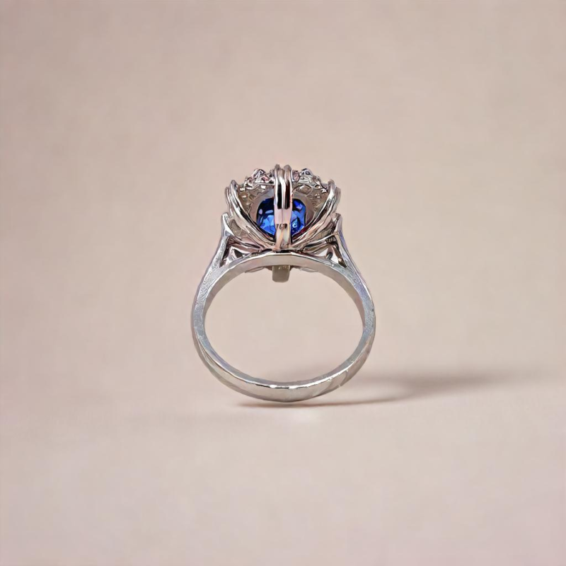 Saraya sapphire and diamond ring in platinum with cushion cut blue sapphire and diamond halo