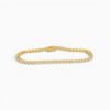 One 18 karat yellow gold bezel set diamond bracelet measuring 17cm in length and 3mm in width.
