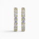 One pair of 18 karat yellow gold shared claw set diamond hoop earrings.