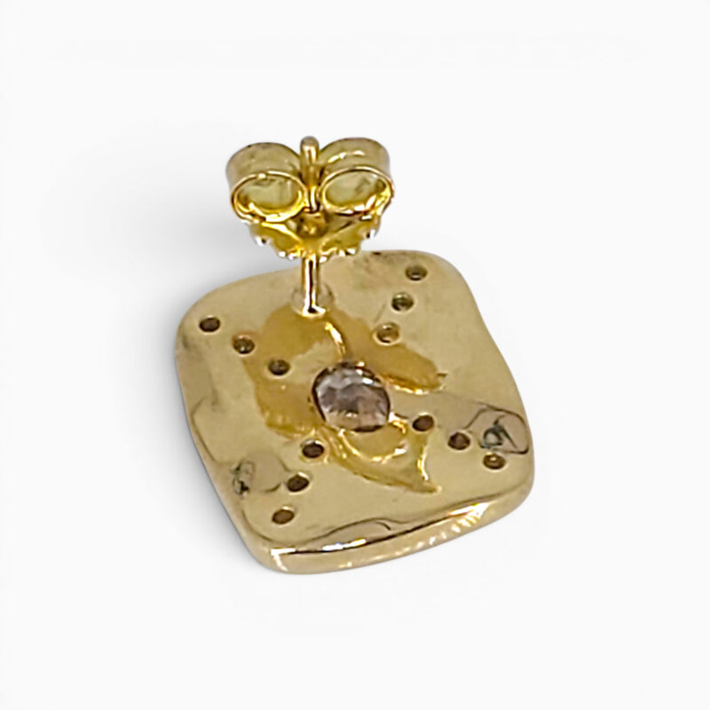 One pair of 18 karat yellow gold grain set organic panel style X shaped diamond earrings.