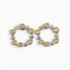 One pair of 18 karat yellow and white gold organic circle rub set diamond earrings.