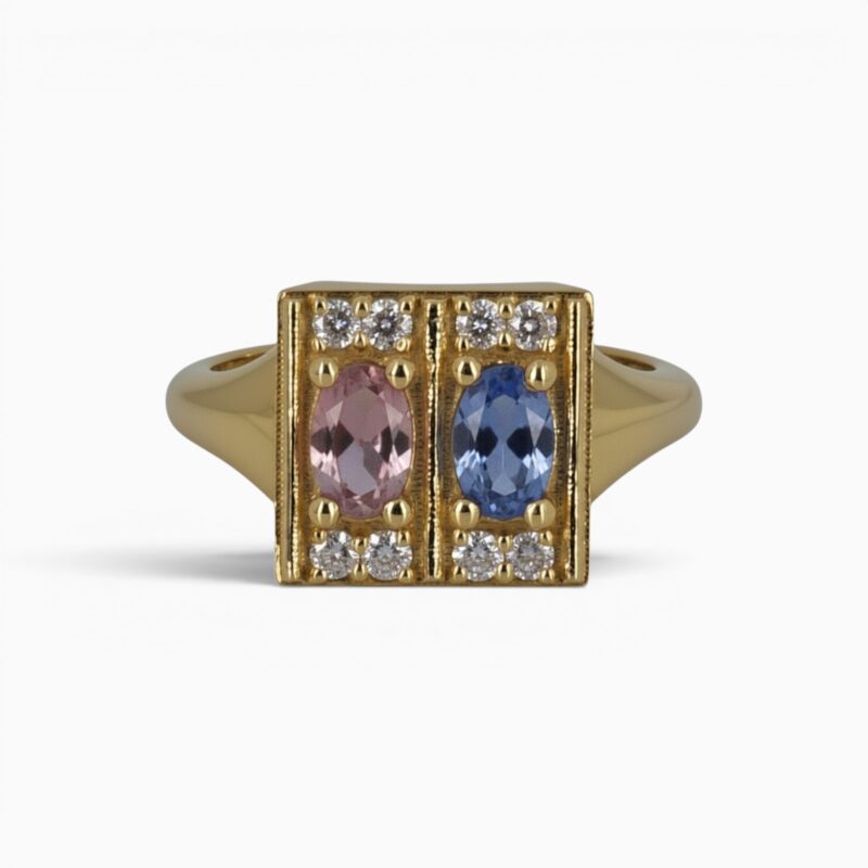 One 18 karat yellow gold claw and grain set sapphire and diamond ring.