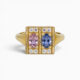 One 18 karat yellow gold claw and grain set sapphire and diamond ring