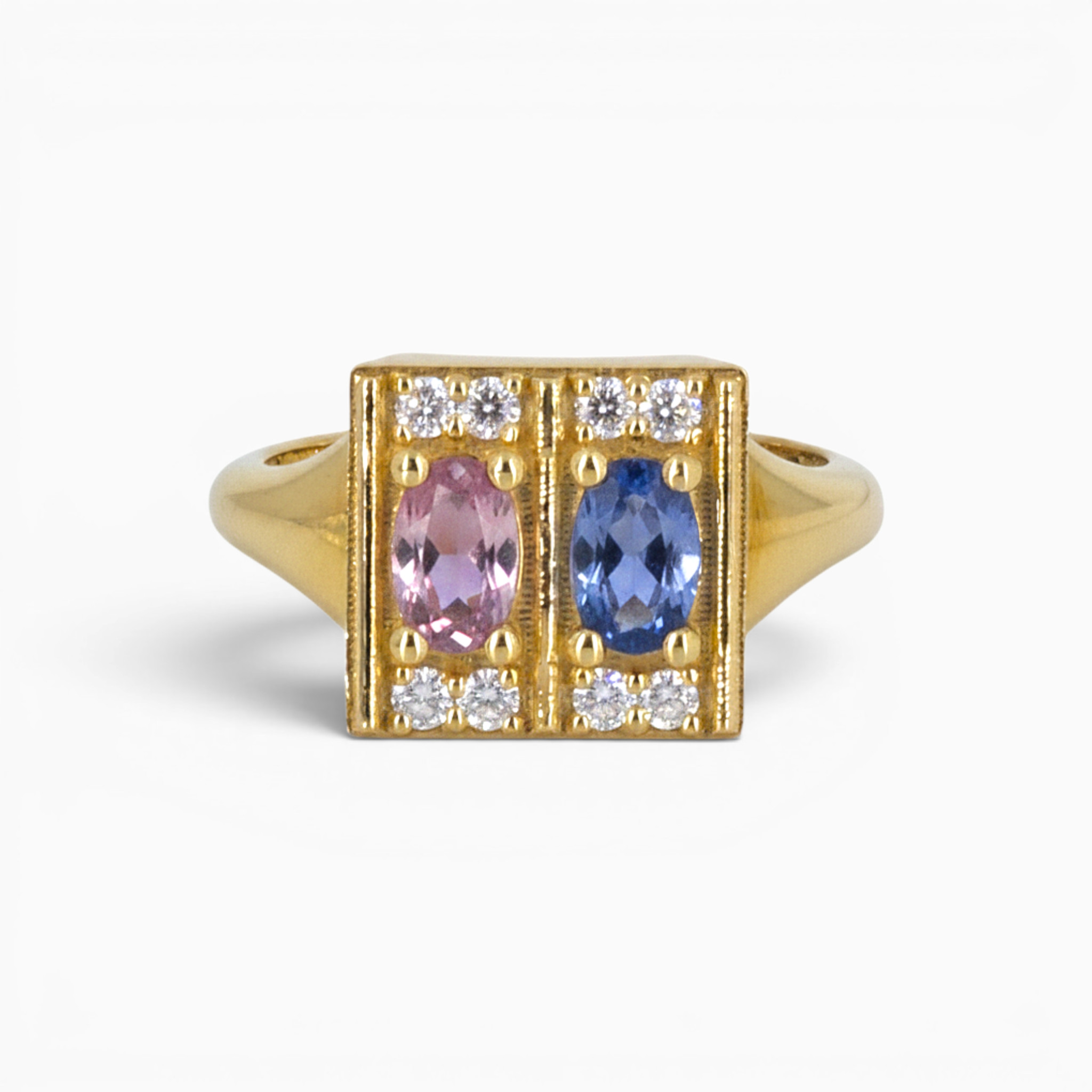 One 18 karat yellow gold claw and grain set sapphire and diamond ring