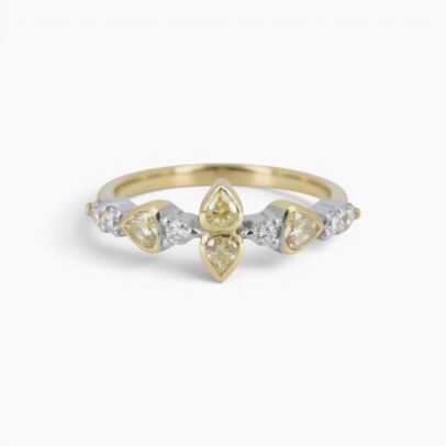One 18 karat yellow and white gold rub and claw set alternating yellow and white diamond ring