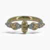 One 18 karat yellow and white gold rub and claw set alternating yellow and white diamond ring.