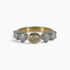 One 18 karat yellow and white gold claw and rub set yellow and white diamond ring.