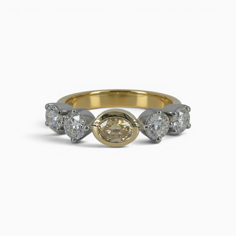 One 18 karat yellow and white gold claw and rub set yellow and white diamond ring.