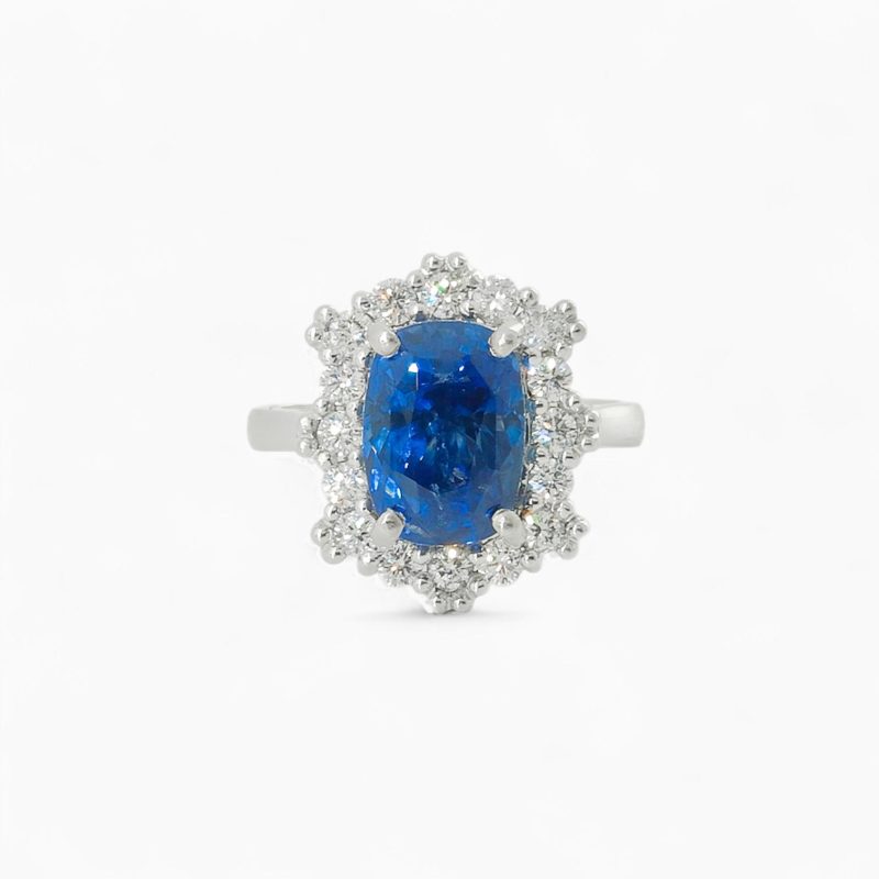 Saraya sapphire and diamond ring in platinum with cushion cut blue sapphire and diamond halo