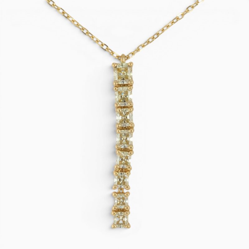 One 18 karat yellow gold yellow diamond pendant and diamond cut trace chain.