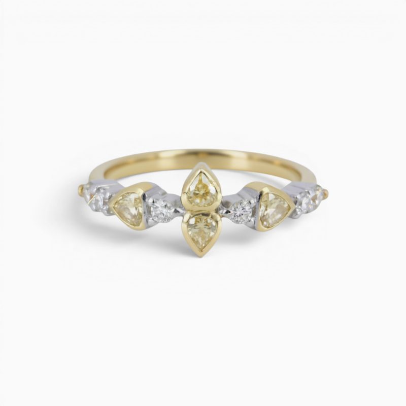 One 18 karat yellow and white gold rub and claw set alternating yellow and white diamond ring