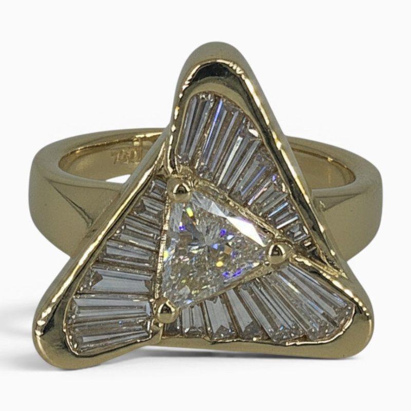 One 18 karat yellow gold channel and claw set flowing triangle diamond ring.